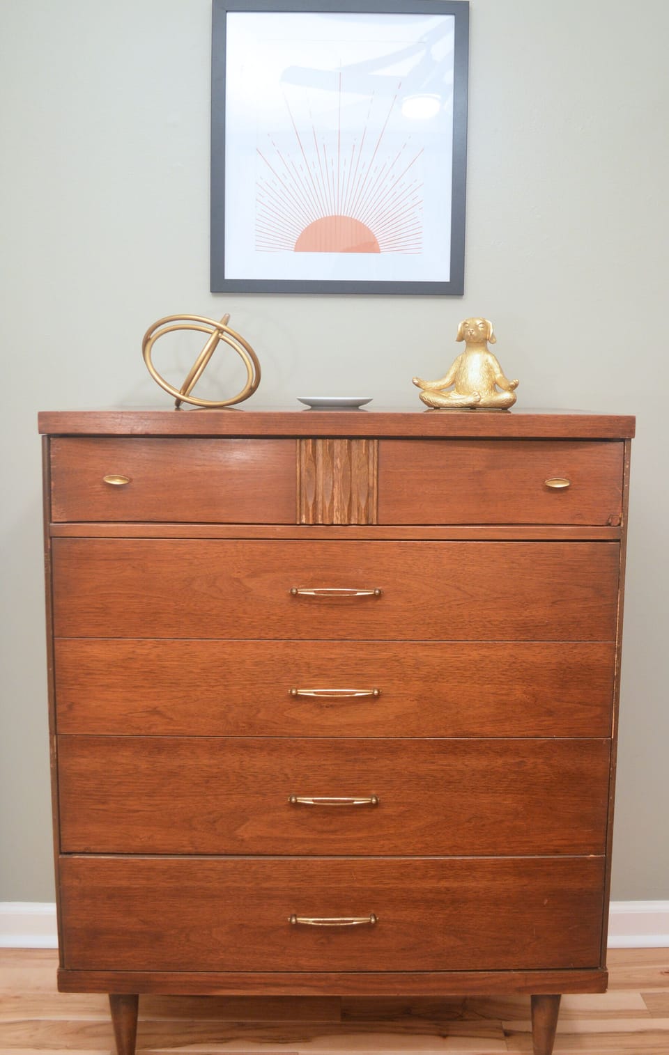 Antique mid century dressers for plenty of storage space.