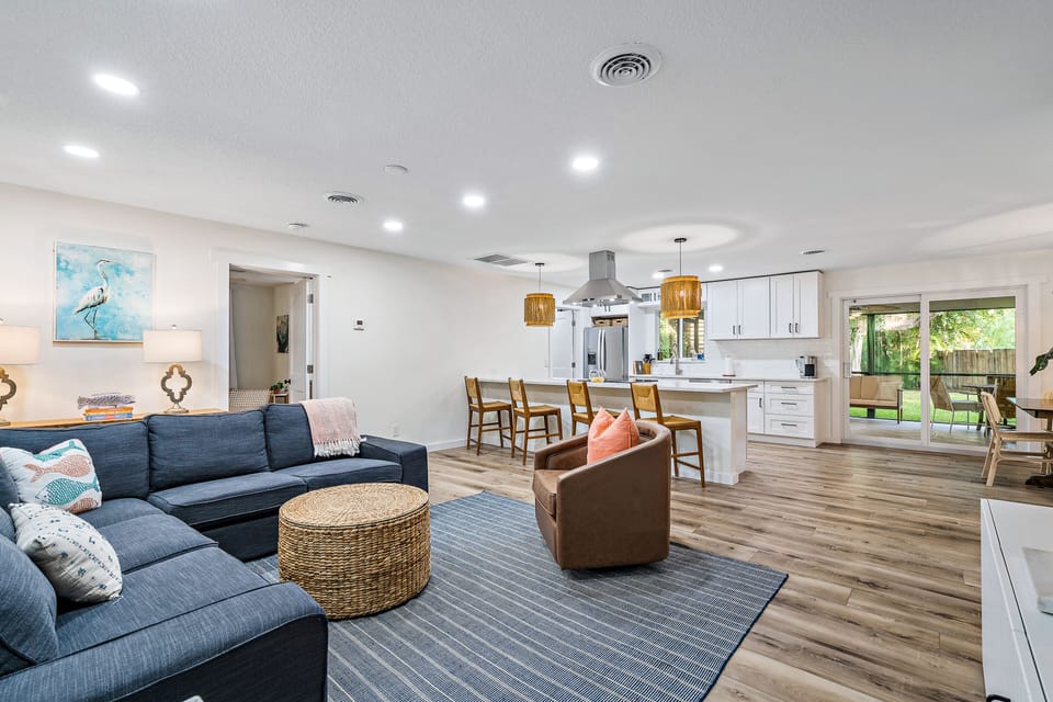 Open concept living and dining area with easy access to outdoor living area. 