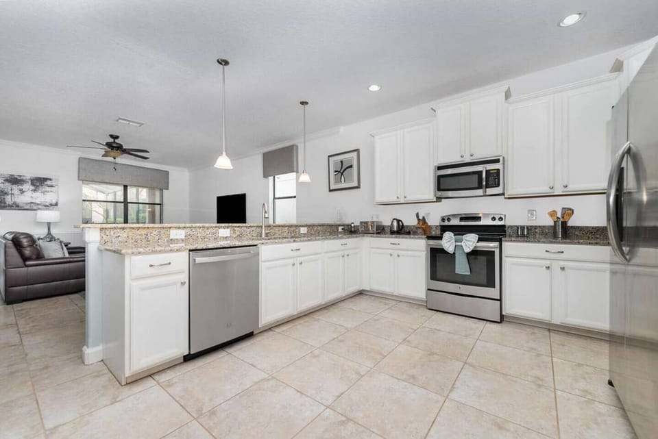 Chef's Delight! Our fully equipped, modern kitchen features stainless steel appliances and ample counter space.