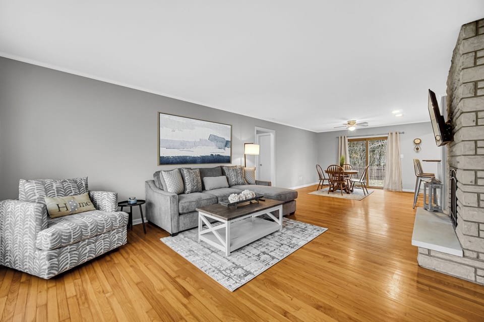 Spacious Open Living Room with Large Flat Screen TV