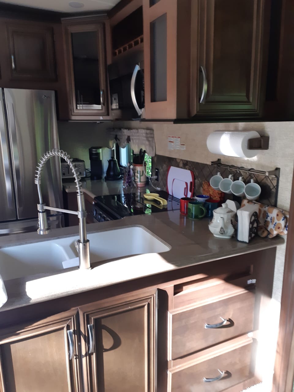 Coffee mugs, a Keurig, kettle. toaster and lots of kitchen tools you'll enjoy.