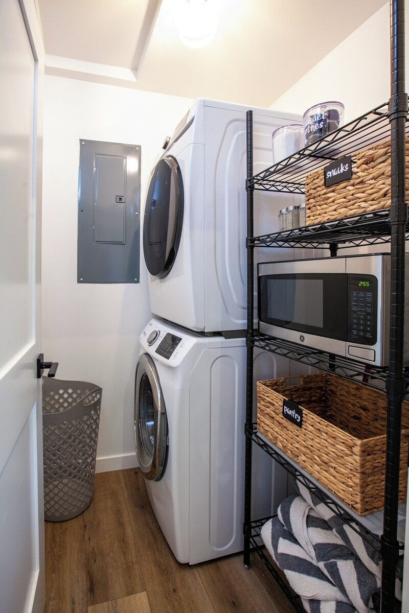 Laundry Room with microwave and pantry storage