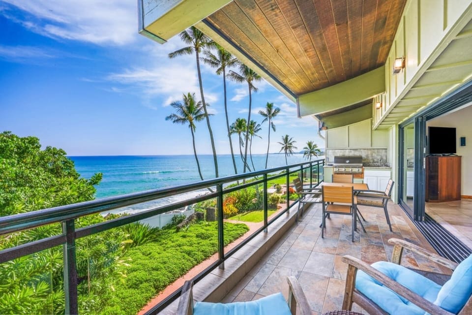 Private seaside balcony offering direct Pacific views and outdoor dining.