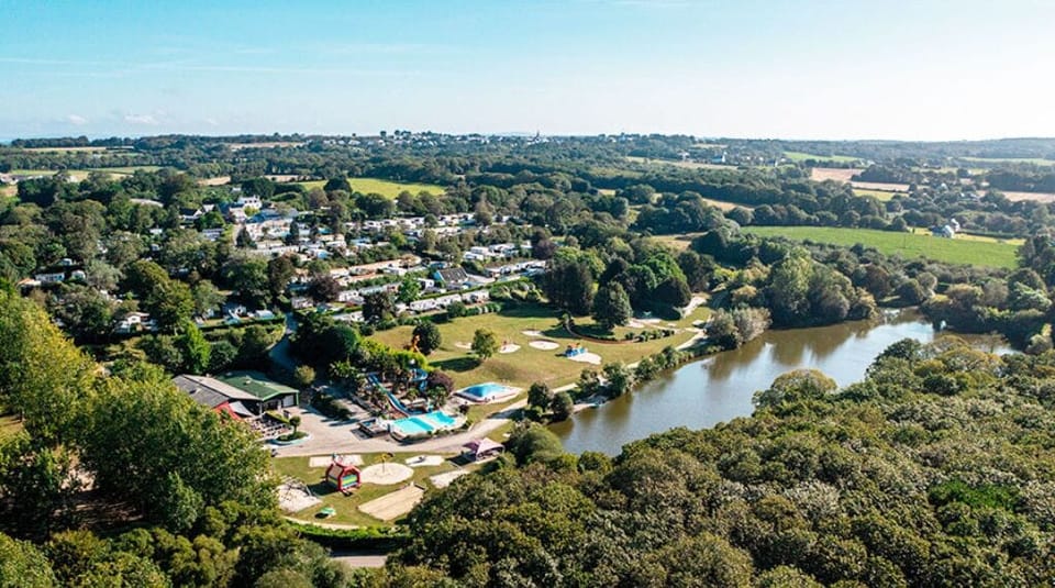 Overlooking a peaceful riverside retreat, surrounded by nature and beautiful views as far as the eye can see.