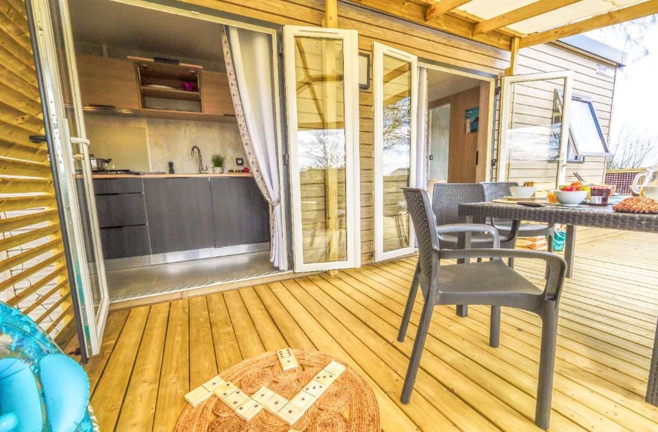 A charming covered patio, perfect for outdoor dining and unwinding in style.