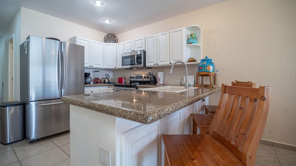 seating at the counter of the kitchen