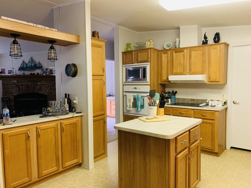 Easy step kitchen with built-in oven, microwave, cooktop, dishwasher and fridge