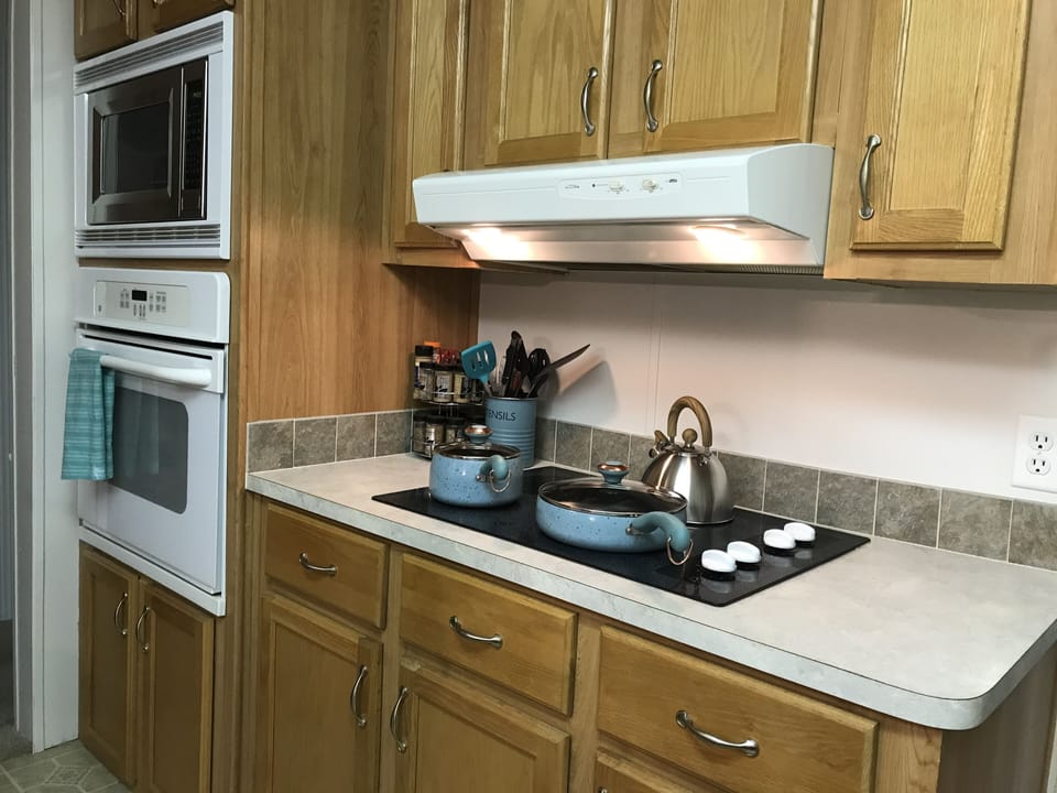 Full set of pots and pans. Cooktop with built in oven.