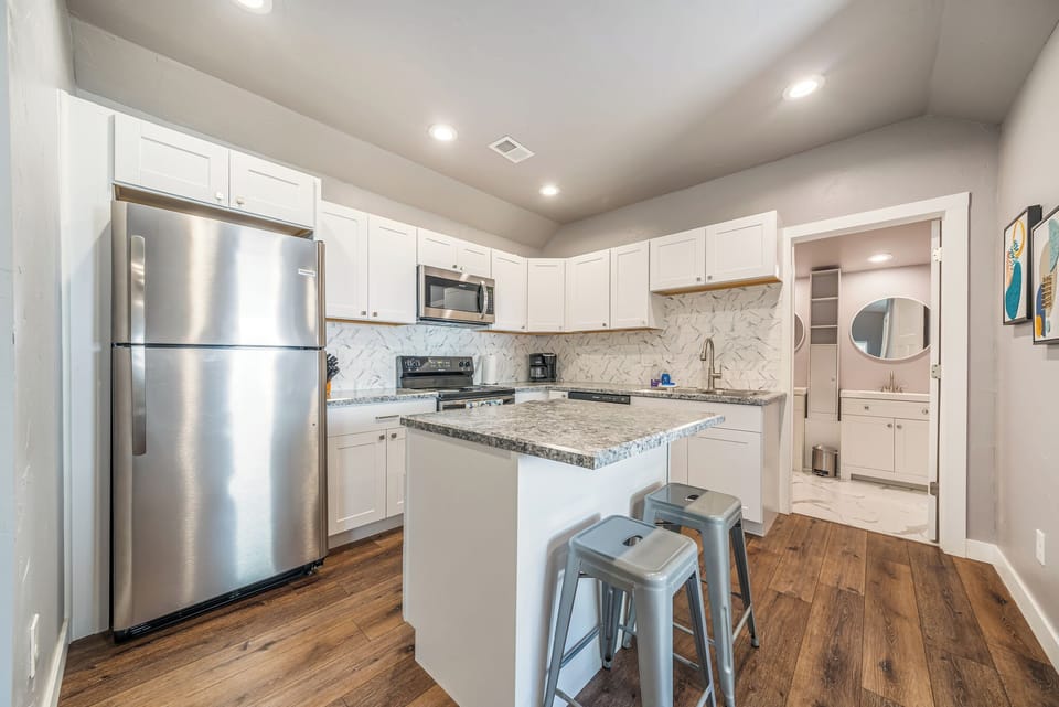 Large fully stocked kitchen with island for two
