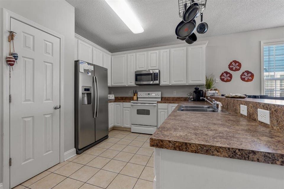 Your fully equipped kitchen features granite countertops, stainless steel appliances, and everything needed to create memorable meals together.