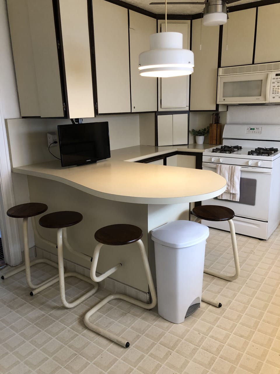Bar stools & tv, so no one misses anything while cooking or visiting!