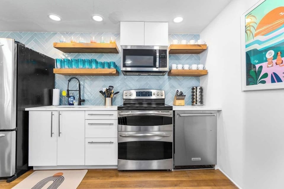 Newly remodeled kitchen with full slab quartz countertop, seating for 8. 