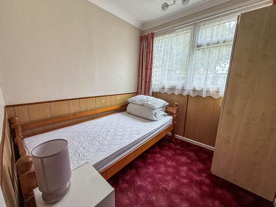 This single bedroom provides a peaceful space for rest after a fun-filled day on the Norfolk coast.