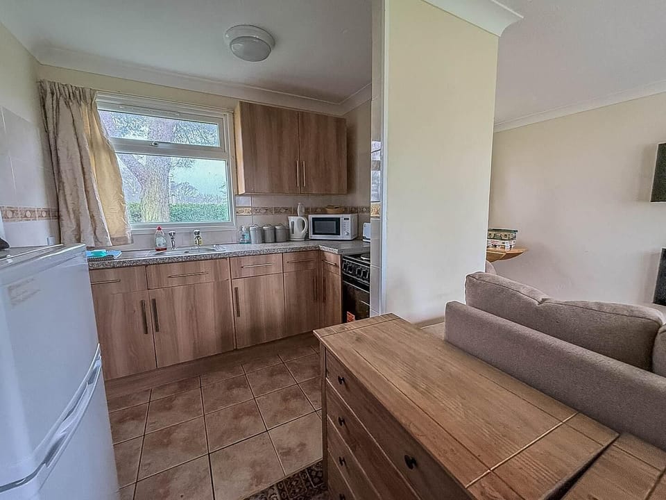 Prepare delicious meals with ease using the kitchen amenities before sinking into a comfortable sofa to unwind after a day by the Hemsby beach.