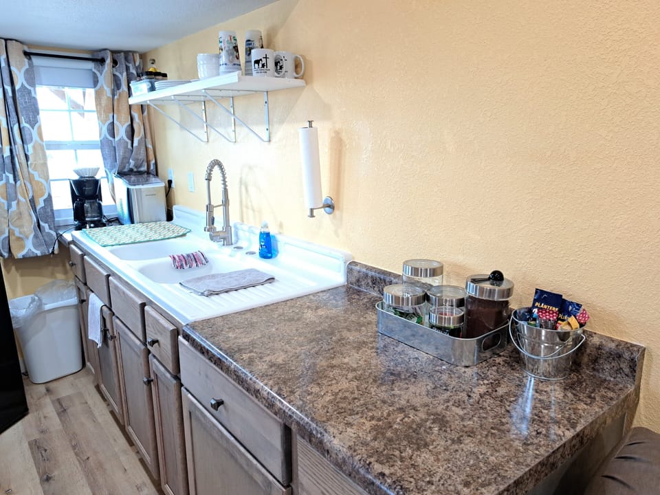Kitchenette with dishes and spices.