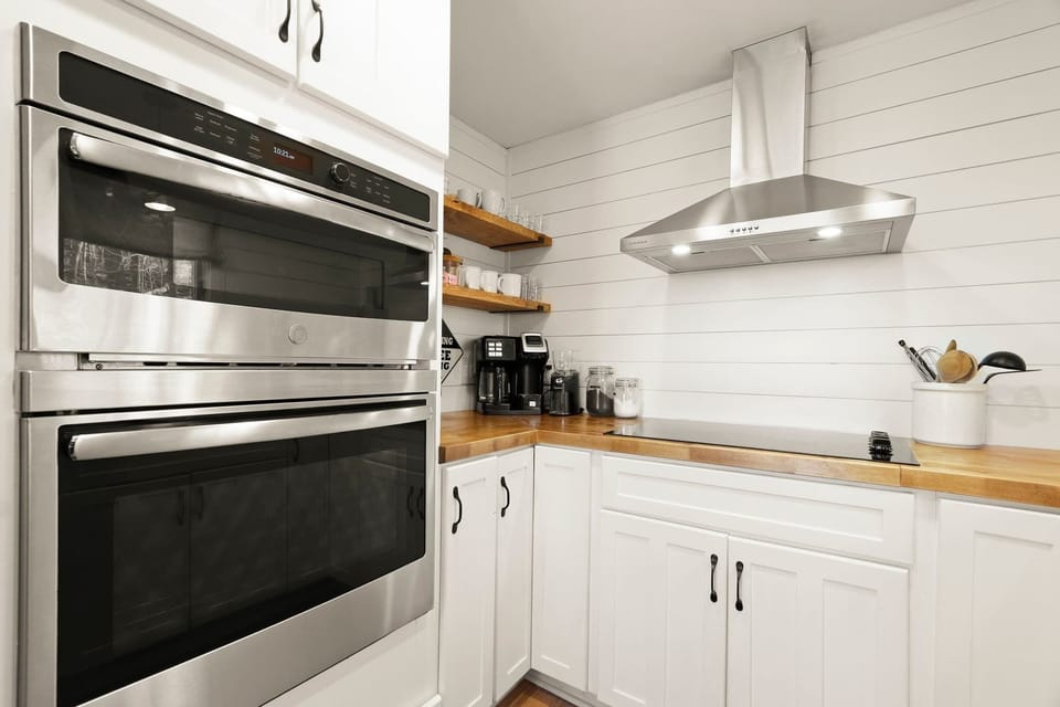 Step into our spotless kitchen, where modern functionality meets pristine elegance, creating the perfect space to craft delicious memories in the heart of Beech Mountain. 🍽️✨