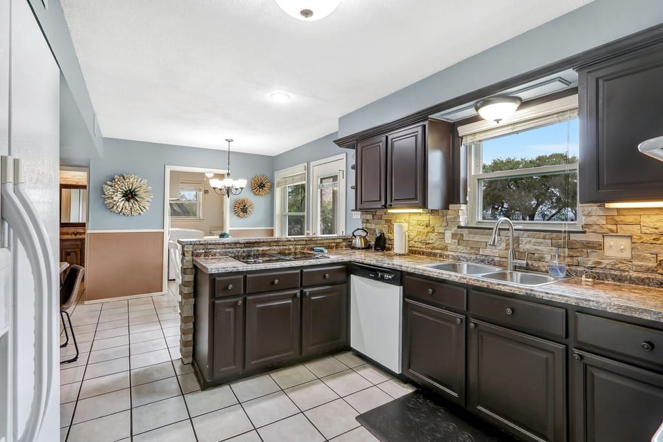 Full kitchen with a stove, over, refrigerator, microwave, and coffee maker