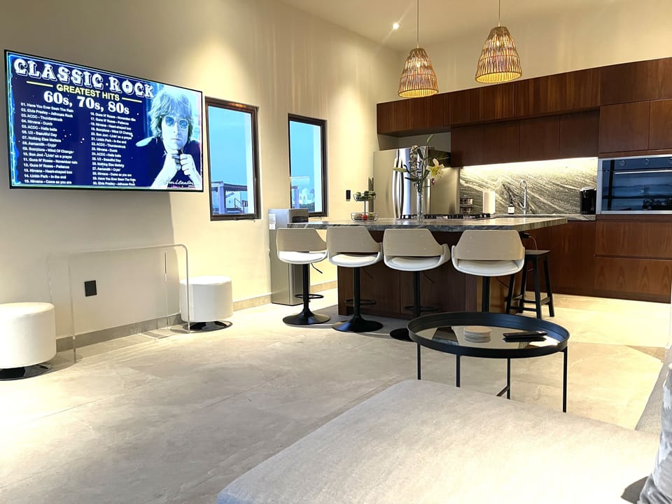 Living room and kitchen with 60 inch TV