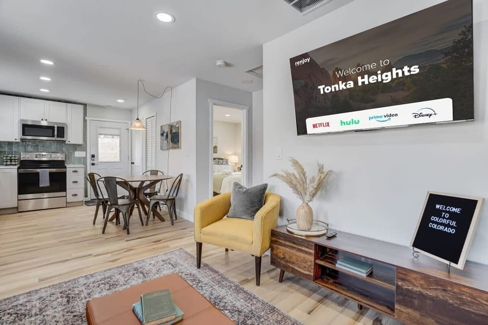 The centerpiece of the room is the large smart TV, perfect for movie nights or catching the big game.