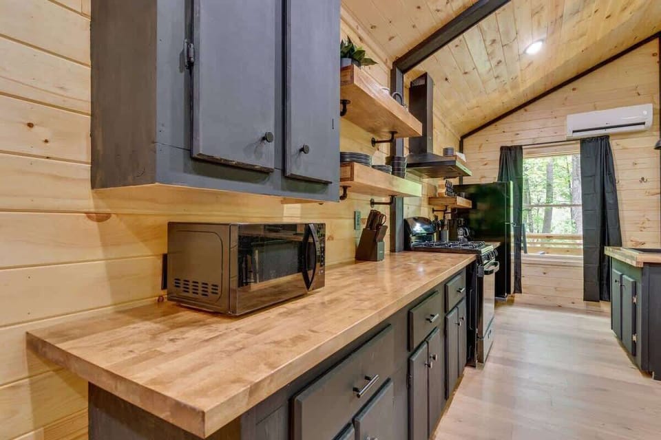 Modern rustic kitchen featuring warm wooden elements.
