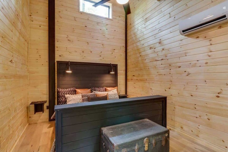 Bedroom 2 - King bed, mounted TV and fireplace.
