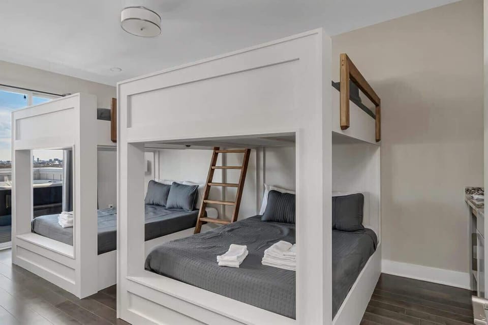 Bedroom 4 - 2 Queen over Queen bunk beds. Top floor with access to the balcony!
