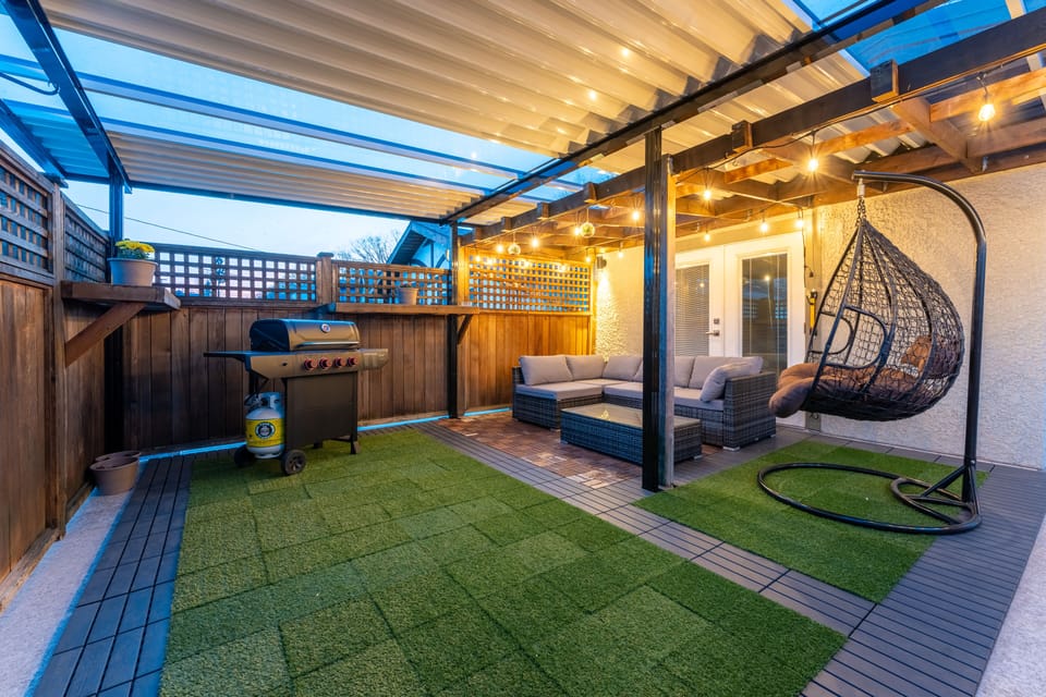 Relaxation awaits in our private patio oasis, complete with a BBQ and cozy swing