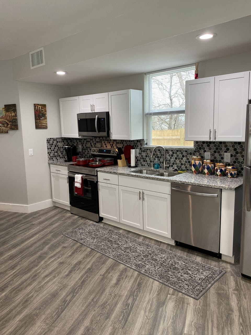 Stocked w/ Starbucks coffee, Keurig, cookware, dinnerware, free bottled water