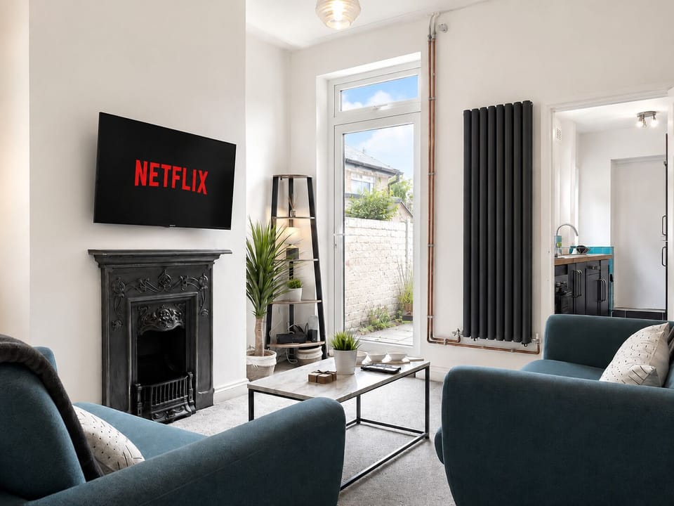Living room (Smart tv with Netflix and all app compatible & Virgin tv standard live channels)