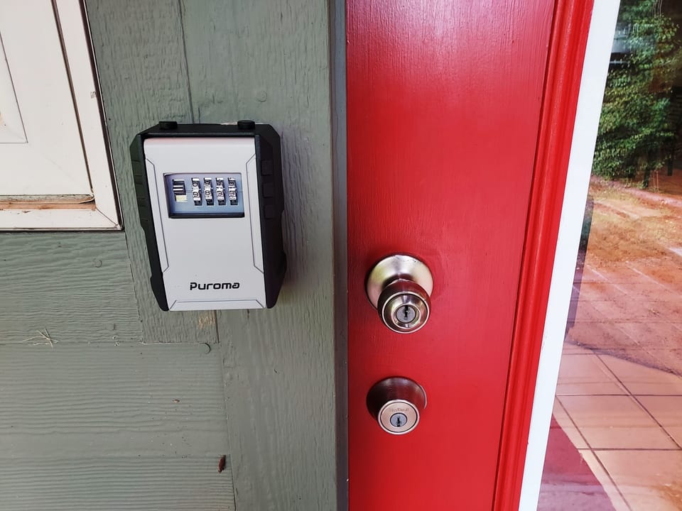 Lock box is located left of door. You will be provided a 4 -digit code.  