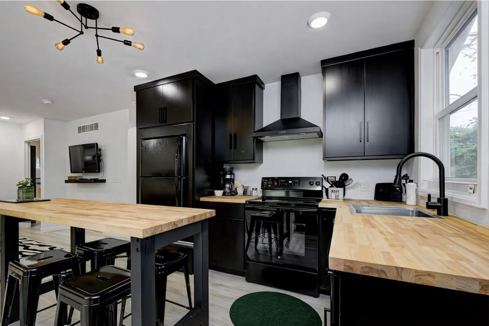 Fully equipped kitchen with island &  bar seating