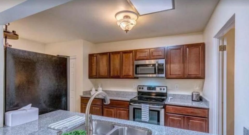 Well stocked kitchen open to dining 