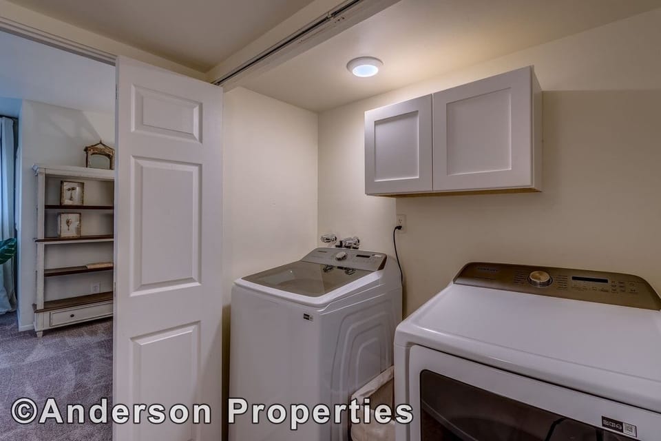 New laundry with brand new full capacity washer and dryer 