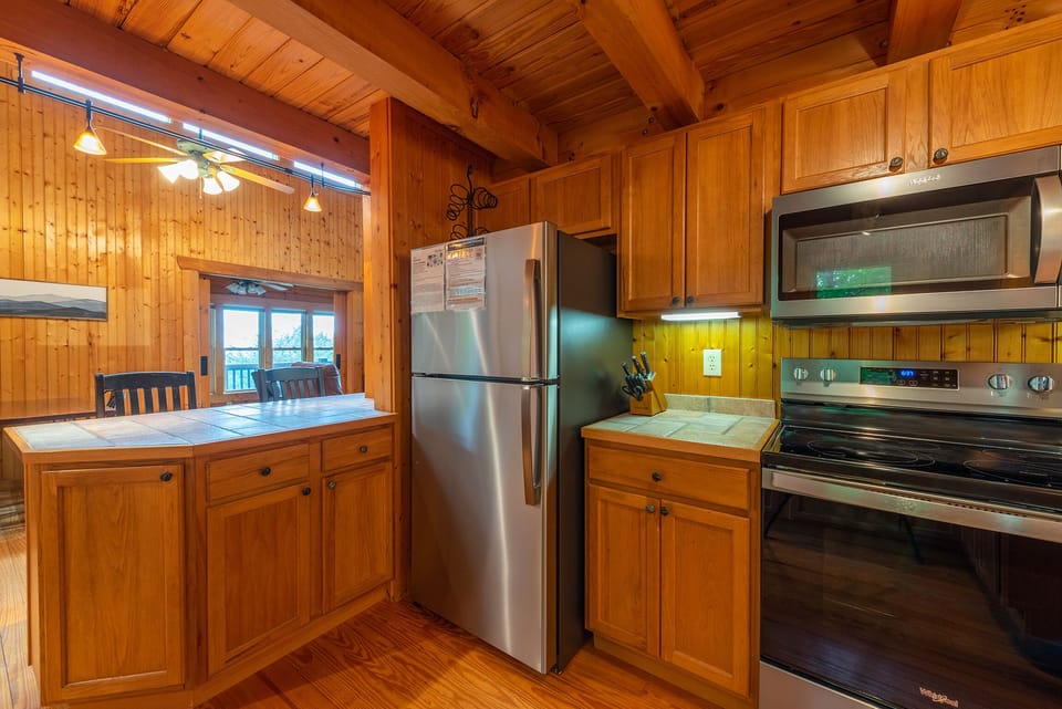 Kitchen with bar seating for 2, dishwasher & 2 types of coffeemakers (standard drip & Keurig).