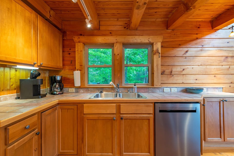 Kitchen with bar seating for 2, dishwasher & 2 types of coffeemakers (standard drip & Keurig).