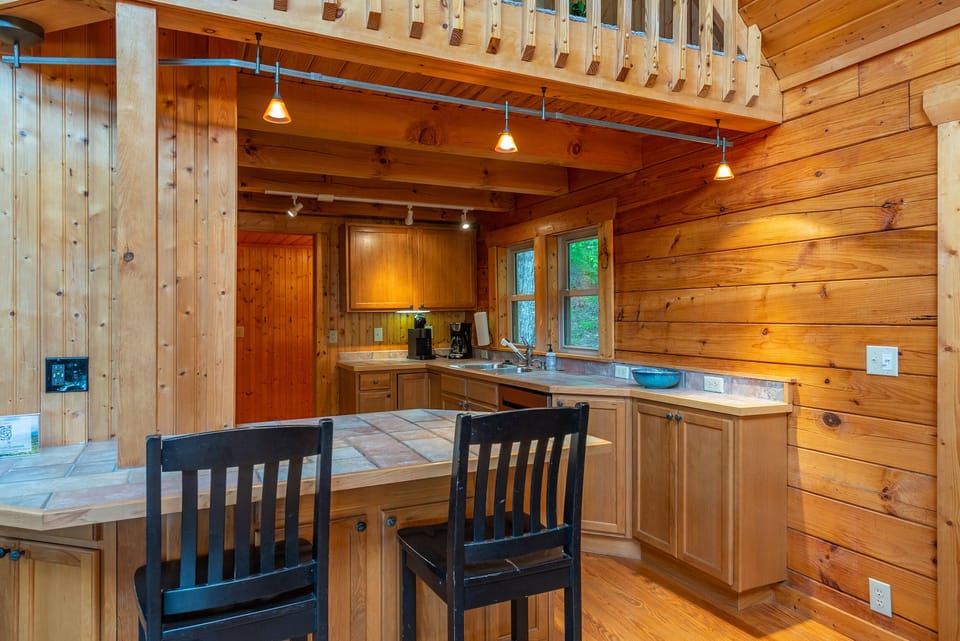 Kitchen with bar seating for 2, dishwasher & 2 types of coffeemakers (standard drip & Keurig).