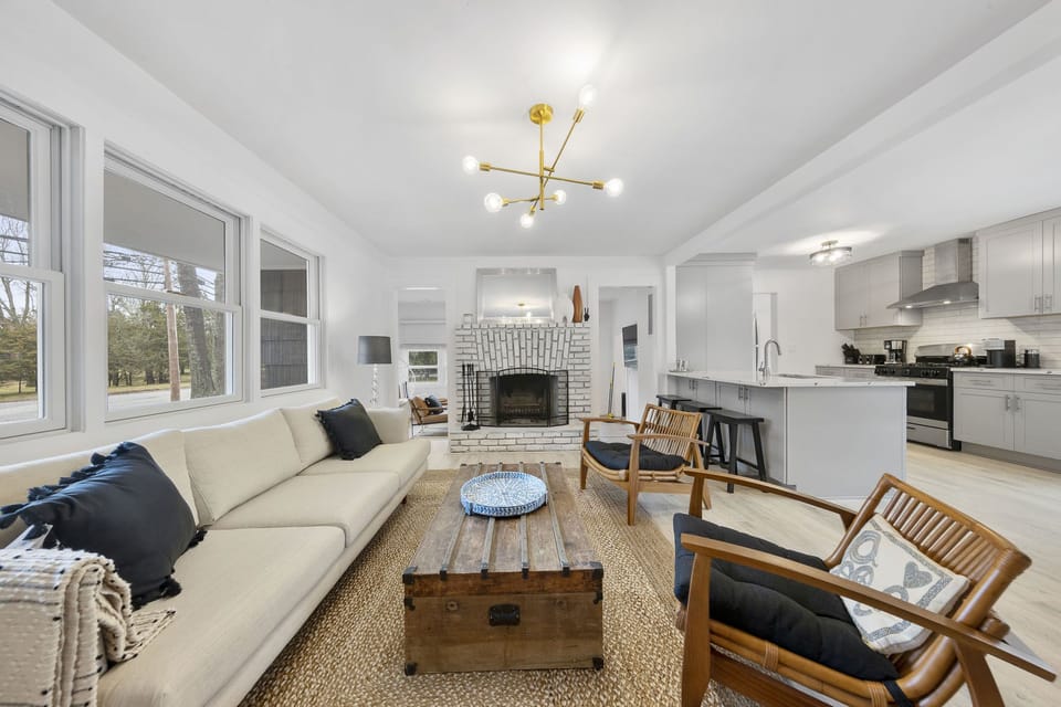 Living room open to the sunroom 