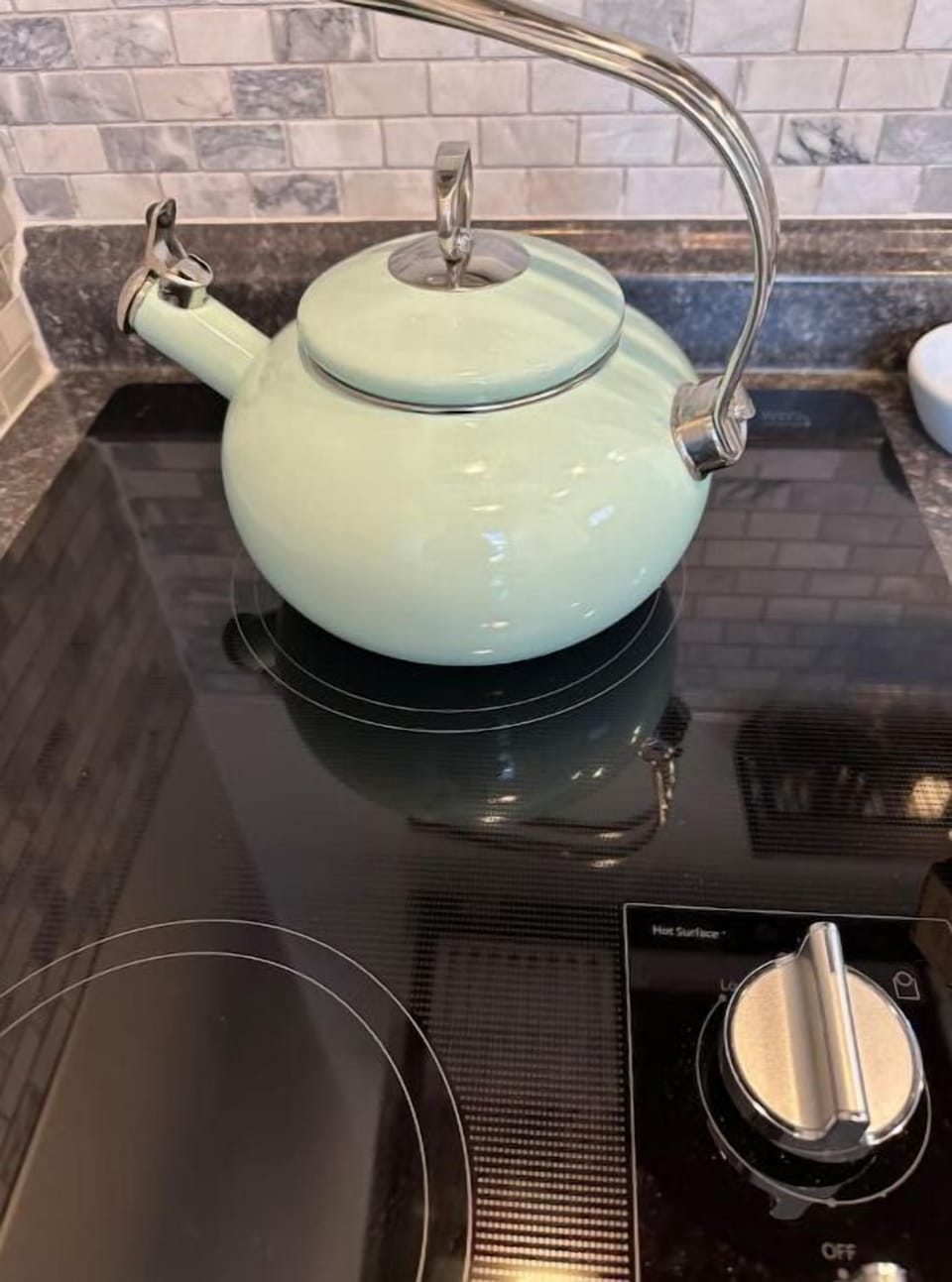 Tea pot on two burner induction stovetop