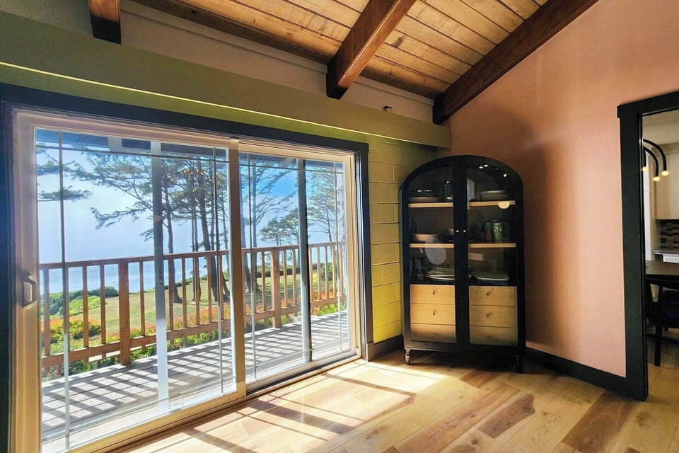 Enjoy the ocean views from the dining room or access the deck to grill up a favorite meal.