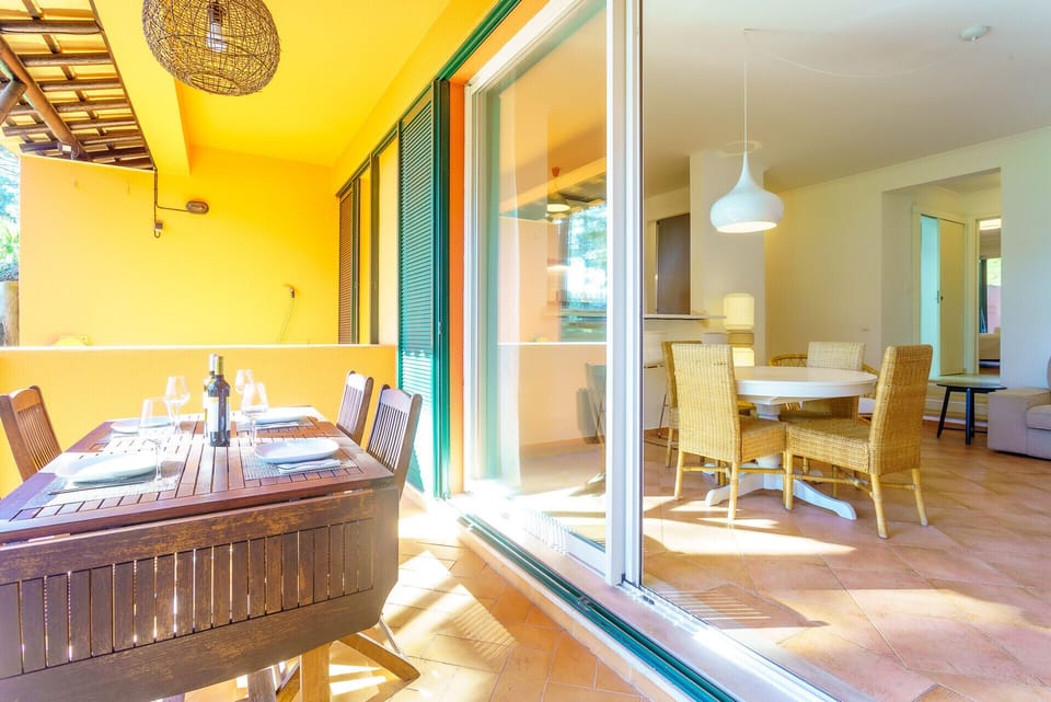 Balcony with table for meals.