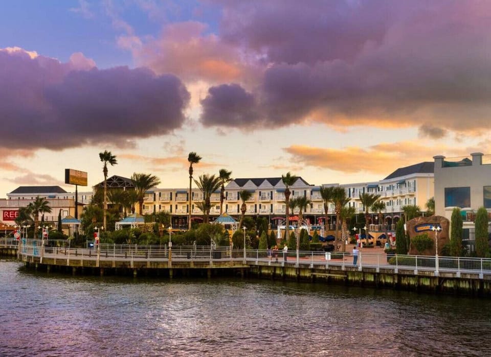 Lakeside building exterior offering beautiful sunset vistas for all guests.