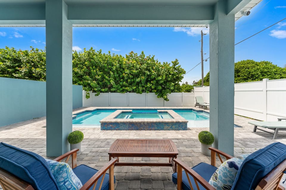 Relax in the shade next to Beach Haven's private pool and hot tub.