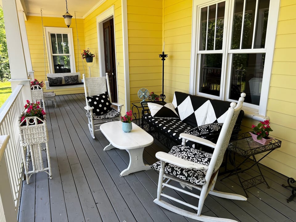 Capacious front porch with swing