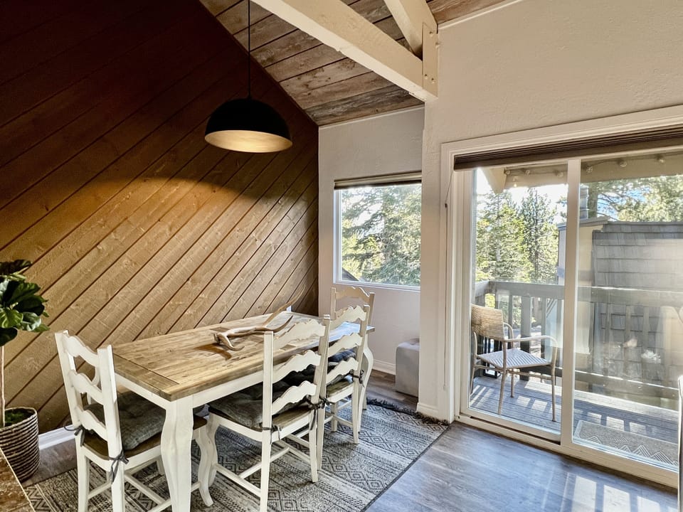 Dining Room with new overhead lighting and seating for 6 people.