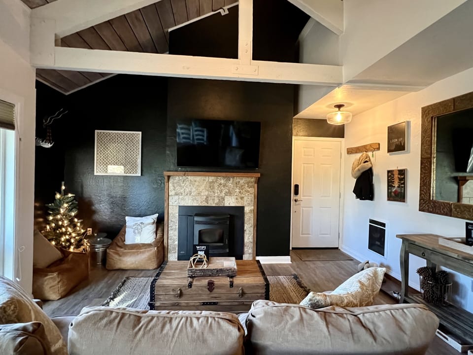 Living room w/ reading nook with moveable faux leather West Elm bean bag chairs