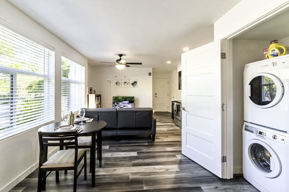 Apt 101 studio unit with the sofa bed, TV, dining table for 2, washer and dryer