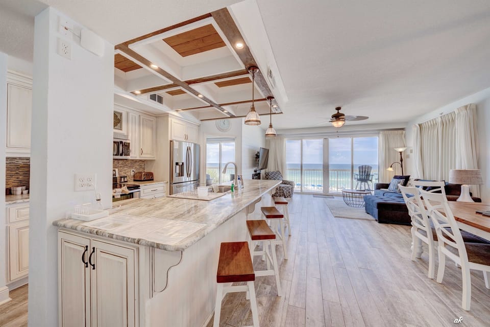dining area has 6 chairs and 4 counter stools
