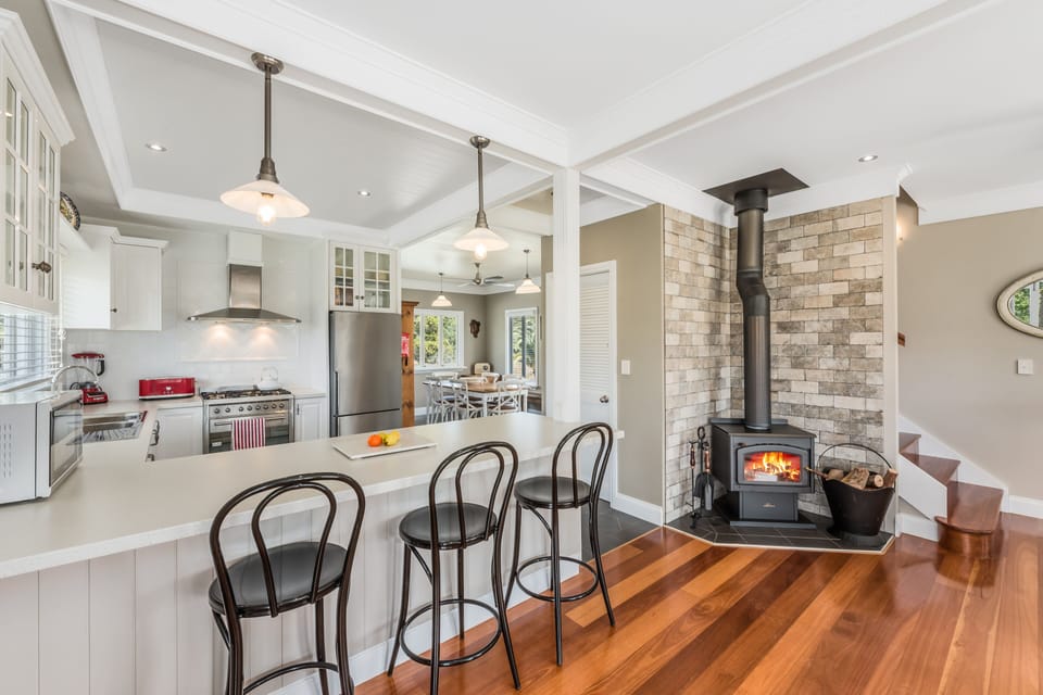 Country kitchen with breakfast bar – downstairs. High chair in wardrobe upstairs
