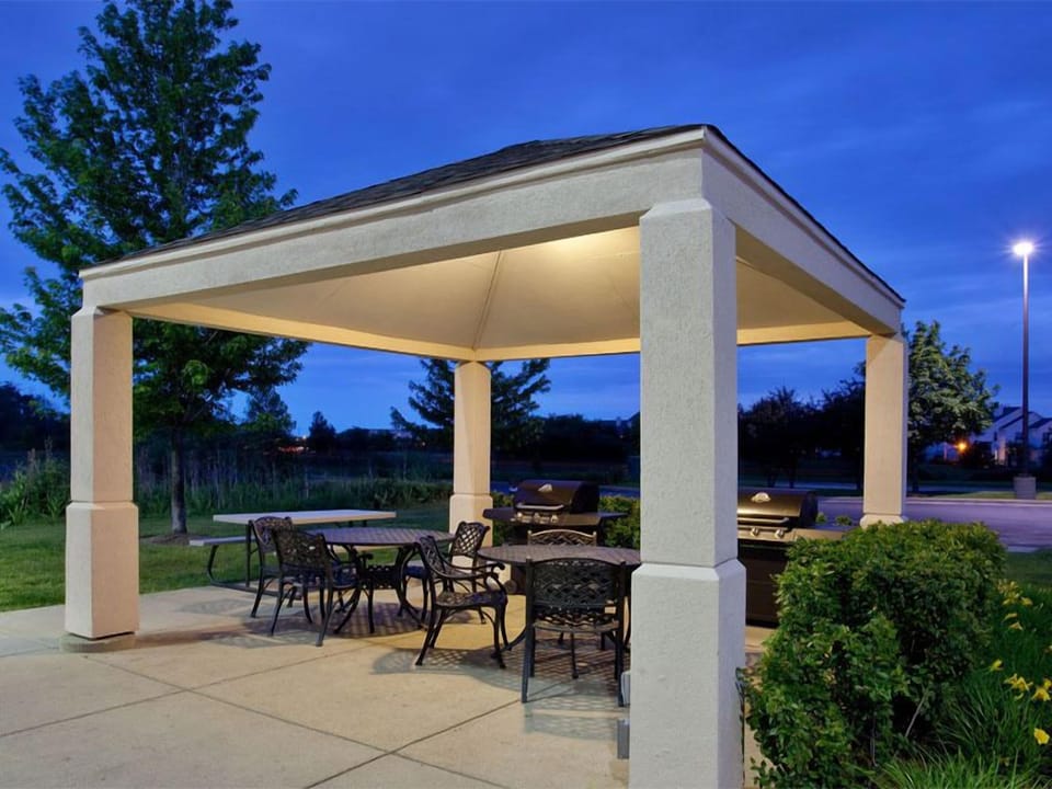 Gather outdoors for sunset grilling under the covered patio.