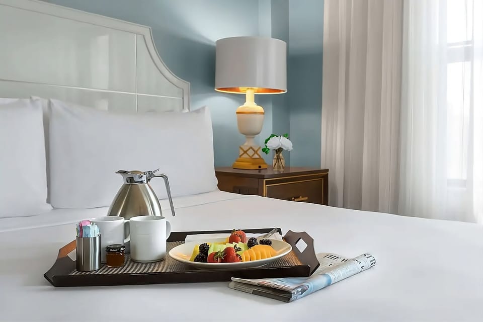 Wake up slowly with breakfast in bed and morning light.